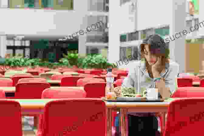 A Socially Anxious Teen Sitting Alone In A Crowded Cafeteria, Feeling Isolated And Overwhelmed. The Socially Confident Teen: An Attachment Theory Workbook To Help You Feel Good About Yourself And Connect With Others