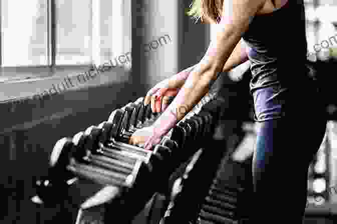 Confident Woman Working Out With Weights In A Gym, Showcasing Determination And Strength Core Performance Endurance: A New Training And Nutrition Program That Revolutionizes Your Workouts