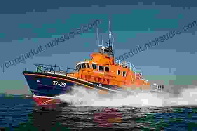 Falmouth Lifeboat Crew Providing Medical Assistance To An Injured Sailor. Falmouth Lifeboat 2024 Service Log: Falmouth Lifeboat 2024