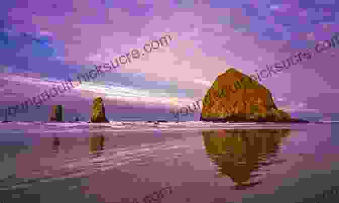 Visitors Walk Along The Sandy Beach At Cannon Beach, With The Iconic Haystack Rock Standing Tall In The Background. Oregon Day Trips By Theme (Day Trip Series)